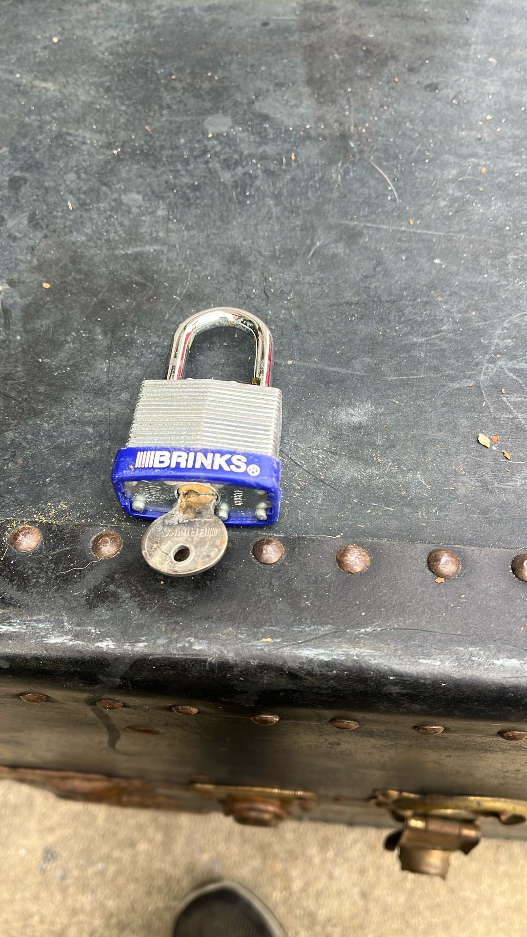 This is a Brinks 40mm Laminated Steel Padlock. It is designed for heavy-duty use and features a chrome-plated, hardened steel shackle for increased cu