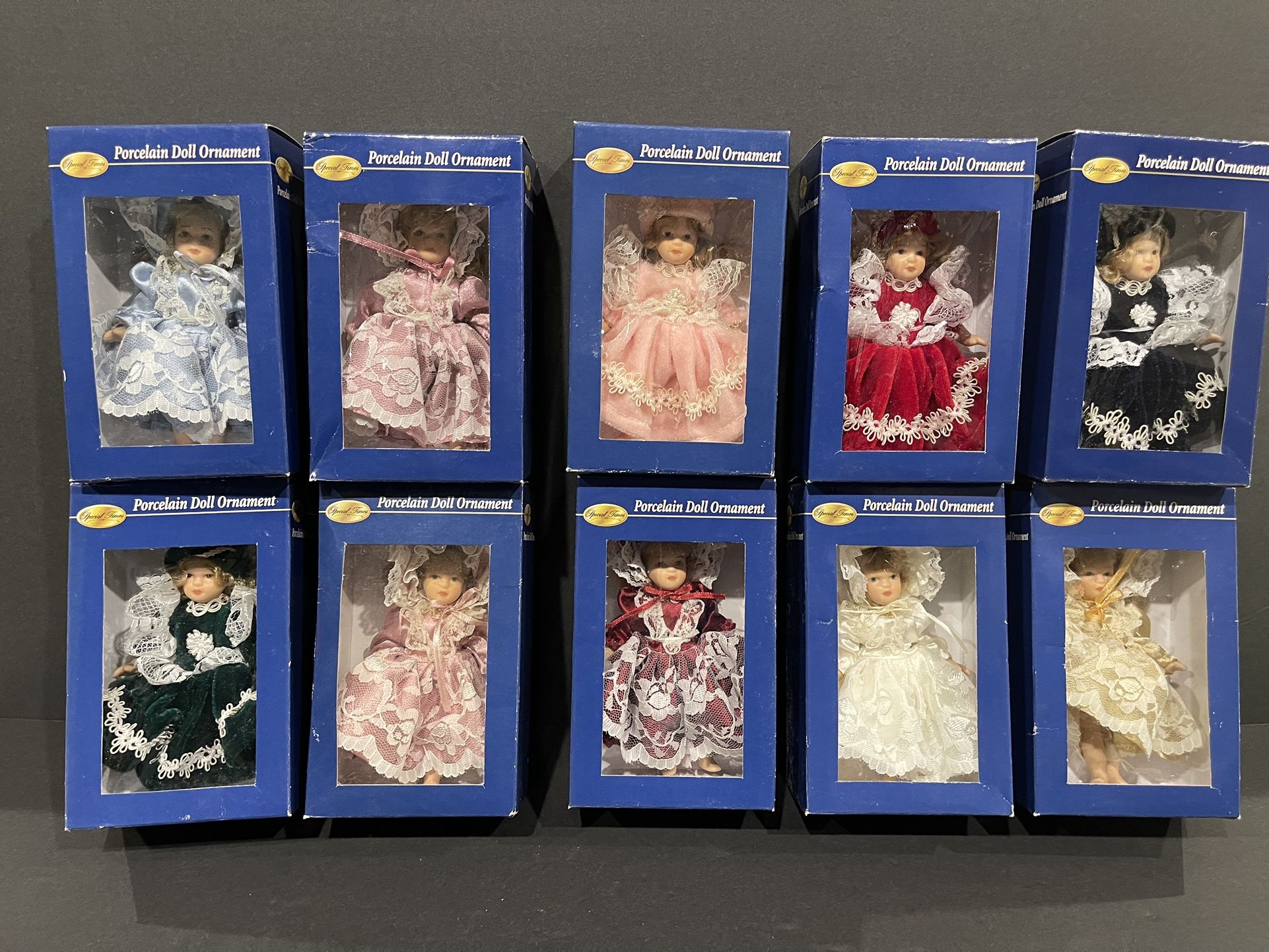 Special Times porcelain doll ornament collection. Includes 10 dolls new in box.