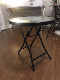 Black metal table with bubble glass