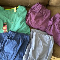Women’s scrubs size Large 1 long sleeved top and 4 pair of pants all new without tags or new with tags