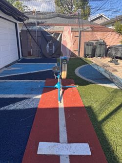 Jugs Pitching Machine, cage, and turf