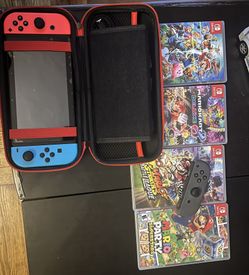 Nintendo Switch , 4 Games , 1 Extra Joycon And SD card