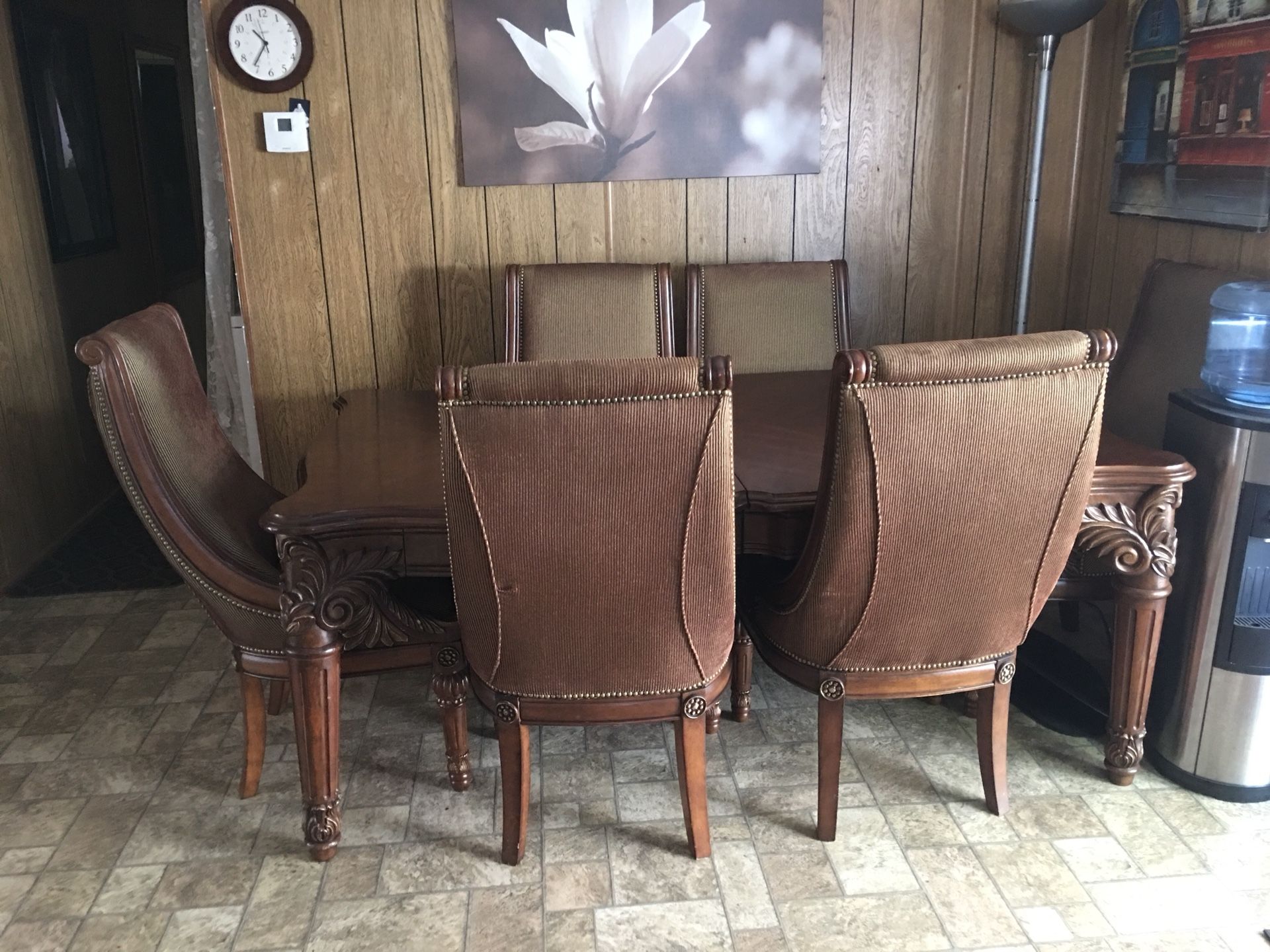 Solid wood dining table with six chairs and two extended if you want to make it bigger