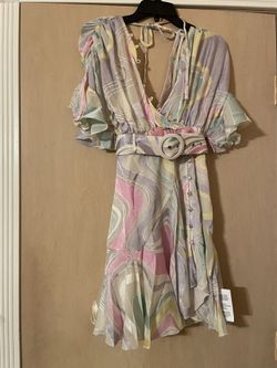 Brand new adorable women’s size XS floral dress with belt. Open back. Very unique  
