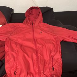 Red Jordan Windrunner size M in men’s