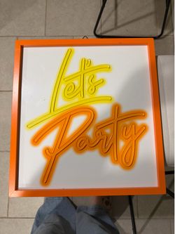Neon “ let’s party” sign