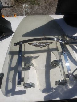 Front glass for a Harley Davidson good condition has its own clamps