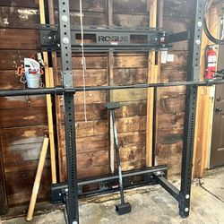 Rogue Lifting Rack With Barbell, Weights and Other Fitness Gear