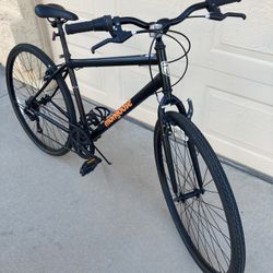 Mongoose Urban Hybrid Bike, 7-speed, 700c wheels, Black / Orange