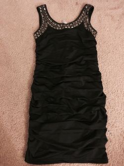 Simple black dress w/studs at top