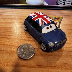 DISNEY PIXAR CARS RONNIE DEL COOPER DIECAST CAR WITH FLAG