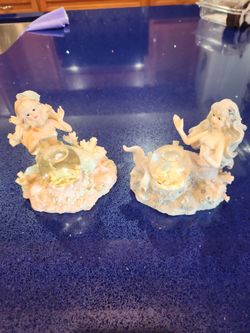 Pair of Mermaid with water filled globe