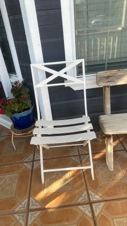 2 outside white chairs