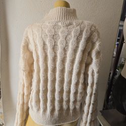 Large  fancy rib Knit sweater. Semi turtle neck pillows sleaves  g  athered at shoulder & cuffs . Cream color very stretchy   size largeer