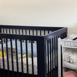 Blue crib with mattress included