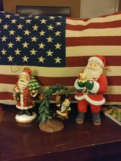 Three Santa decorations, one on the left is an ornament. Selling as a set only.