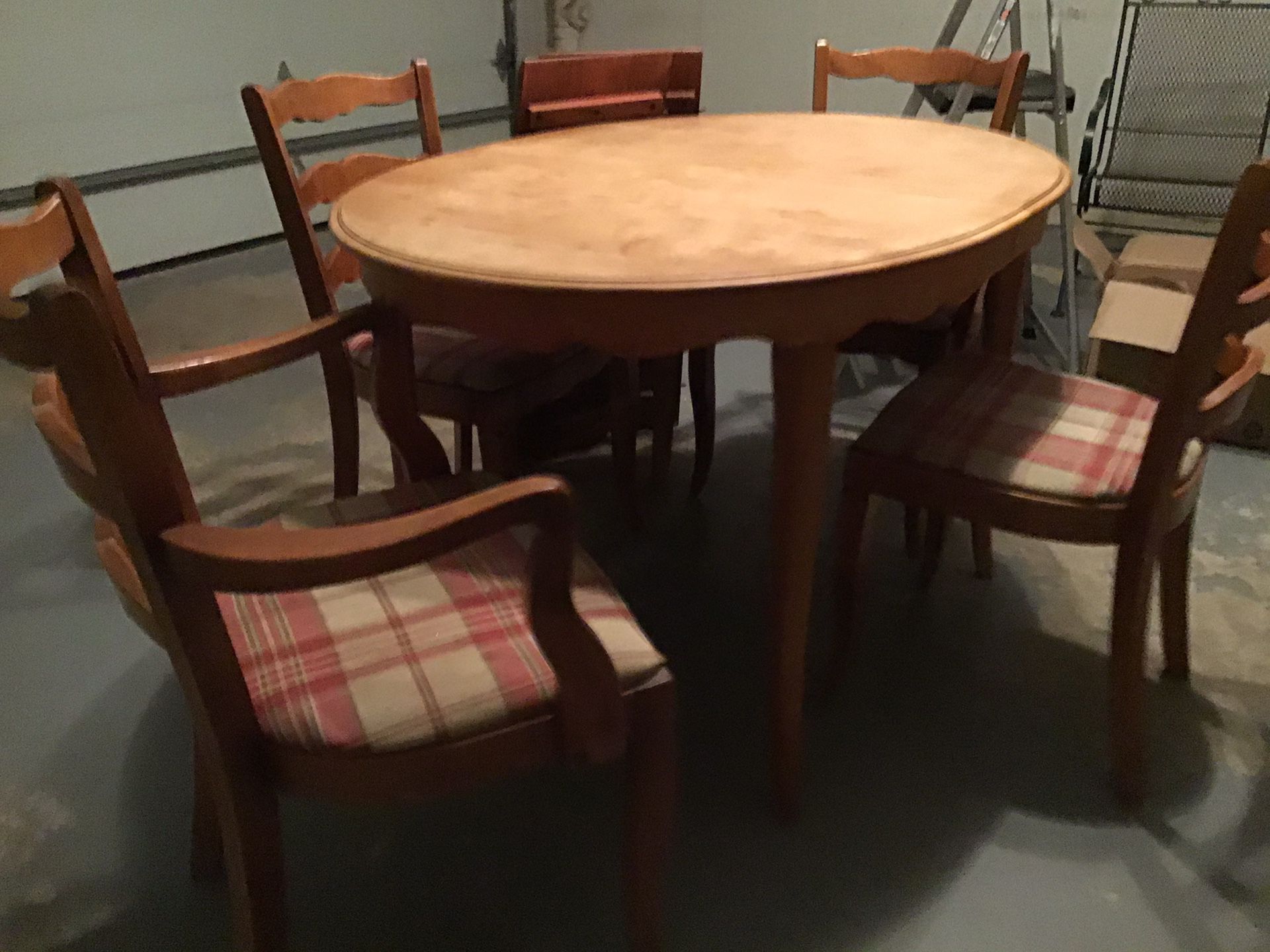 Solid fruit wood dining table and four chairs.