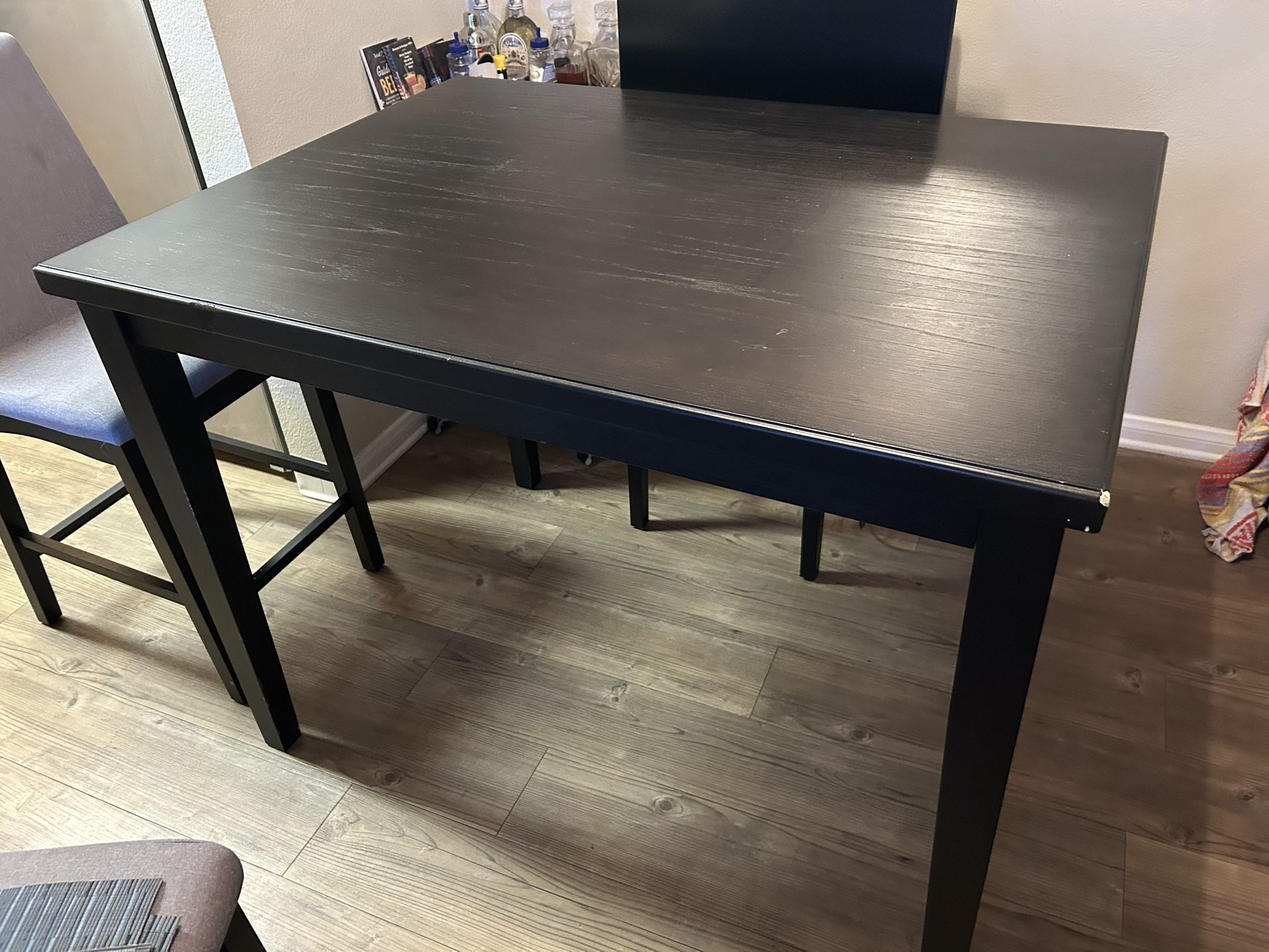 Black Wooden Table With 4 Gray Chairs