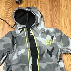 Softshell Fox Racing Pit Jacket in a black/grey camouflage pattern. 