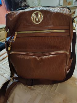 Micheal khor back pack / purse