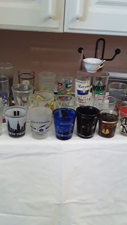 23 decorated glasses from different country and state
