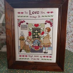 Vtg Cross Stitch needlepoint framed crewel "We love Him because He first loved us"