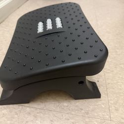 Footrest with massage roller