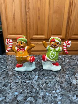 Vintage Cute Ceramic Gingerbread Man and Woman Pair of Salt and Pepper Shakers.  Size approximately 3 1/2 inches tall.  Brand new never used with stic