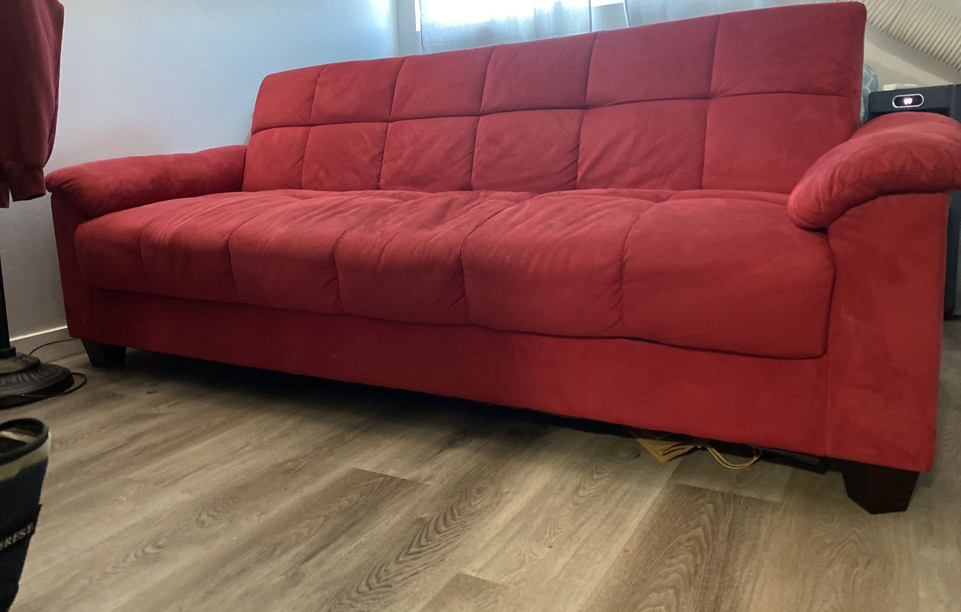 Red futon couch