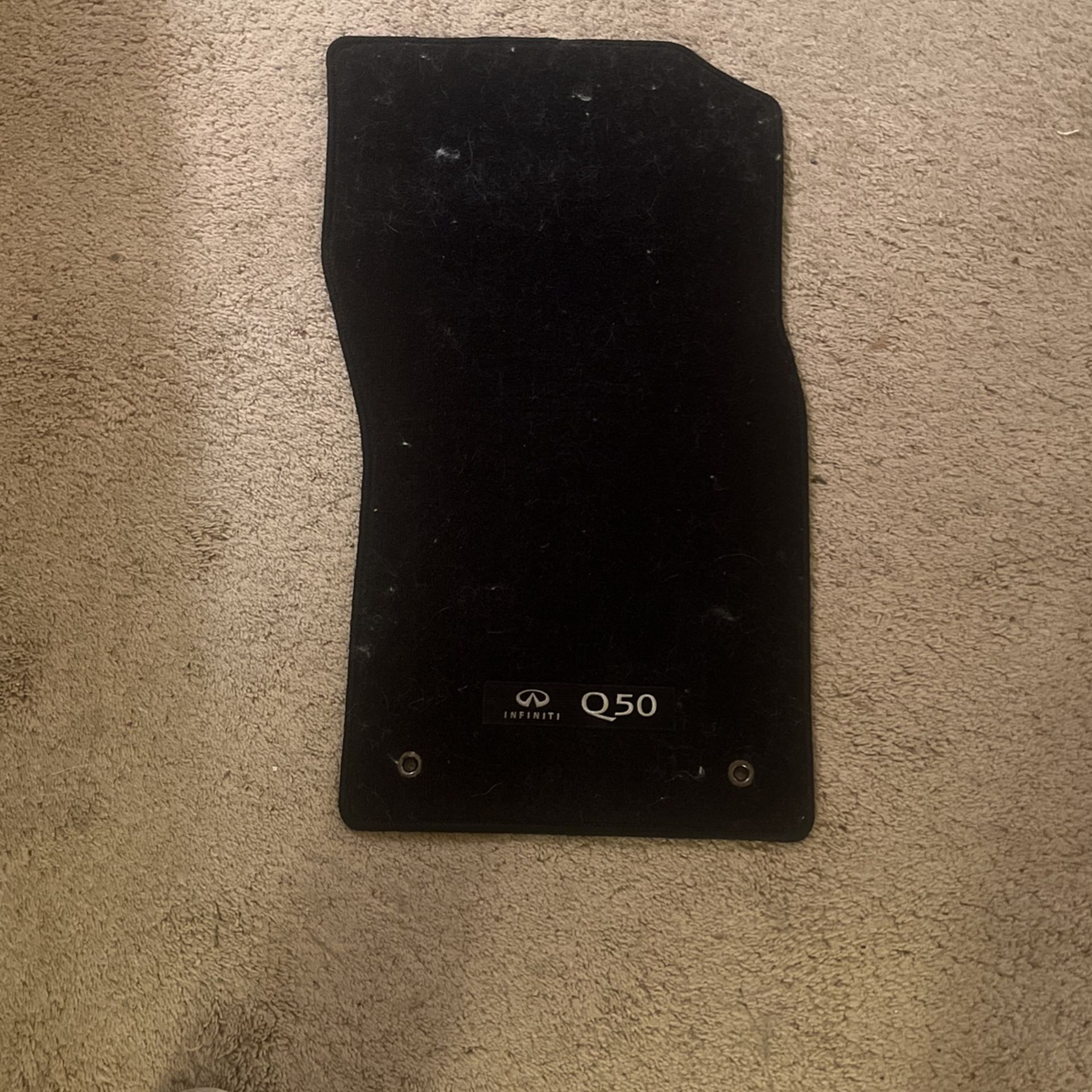 4 carpeted floor matts from a 2017 Q50 Infiniti