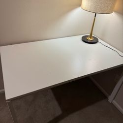 IKEA white desk with metal legs.