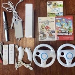 NINTENDO WII with Mario Kart,New Mario Hros. WII Sports + 2 Controllers
