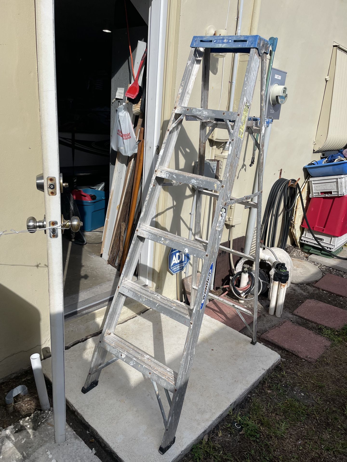 Aluminum A-frame ladder has small bit of damage. See last photo still works good.