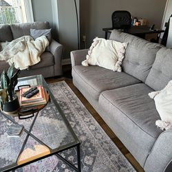 Two Couches Plus Pillows AND Two Glass Tables 