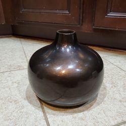 2 Brown round glass vases