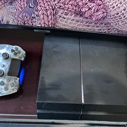PS4 With Controller And A Game