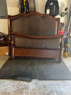 Queen bed. Wood and leather.
