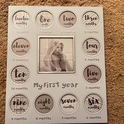 My first year baby frame, one through 12 months very cute never been used for infants and babies first year of memories