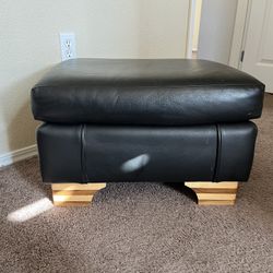 2 Black Leather Ottomans