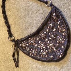 Genuine leather Purse brown has bling on both sides , picking Up Different Colors !
