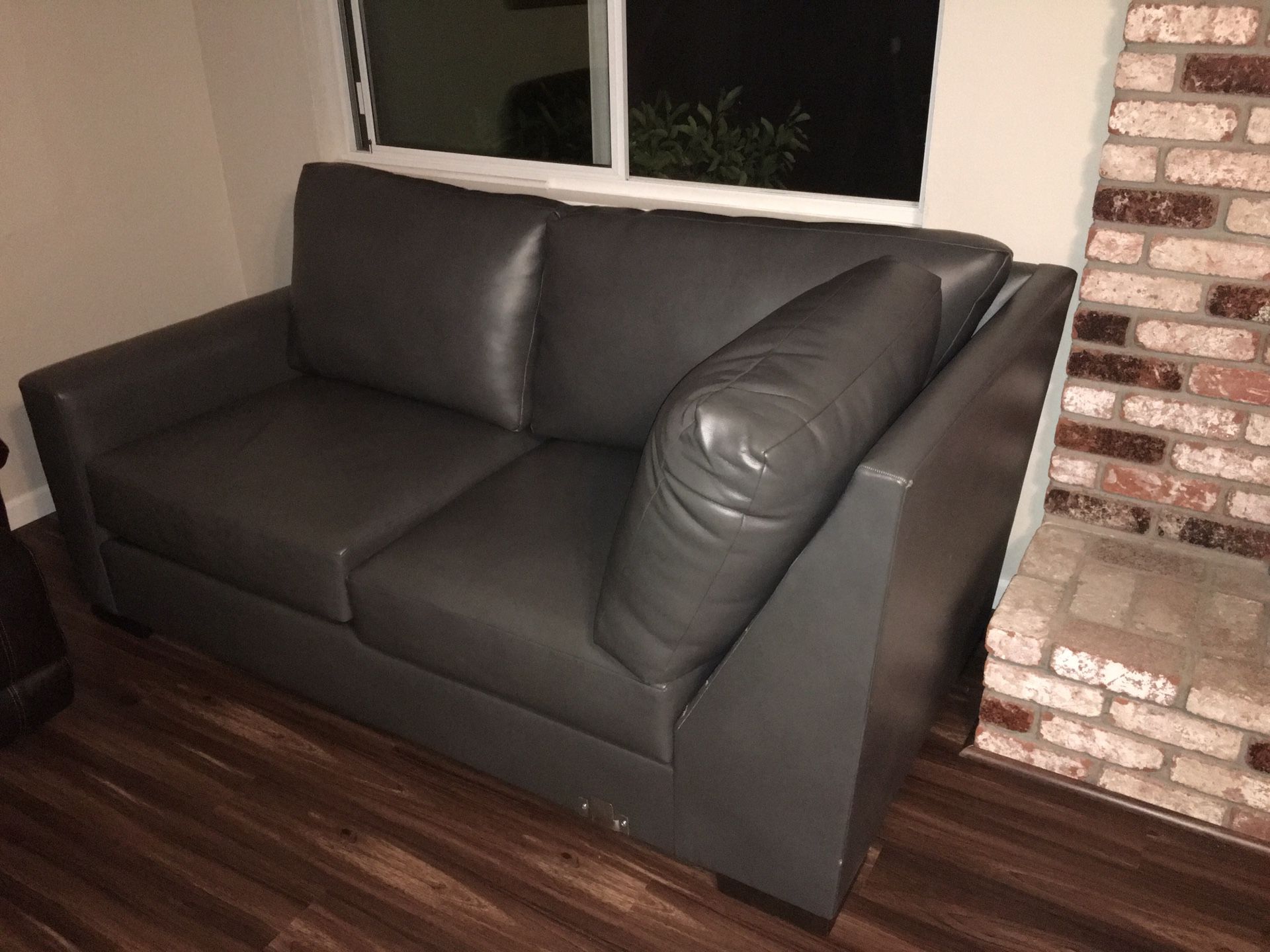 New grey faux leather couch