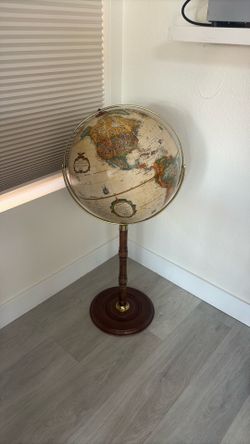 This antique-style Replogle Commander II floor globe features a 16-inch diameter sphere and a turned walnut-finished wood https://offerup.com/redirect