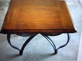 Two wrought iron legs and wood top end tables Thumbnail