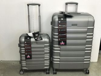 2 pice hard case luggage set includes large size 30"x20"x12 (up to 50Ib) and TSA accepted carry on Size 20". Features a built-in lock and spinner whe