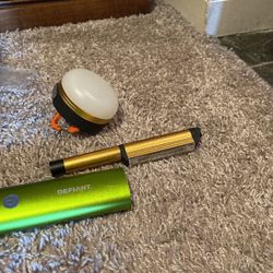 Magnetic flashlight, the green defiant brand with three settings of lights, and two chargers, and the round Hanging/magnetic Light