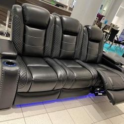 Ashley Power Reclining Sofa With adjustable headrests 