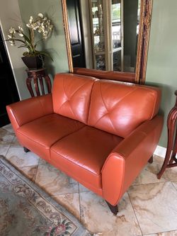 Leather loveseat , length-5ft,  height- 3ft