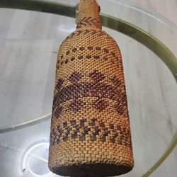 Antique Native American basket woven covered bottle.