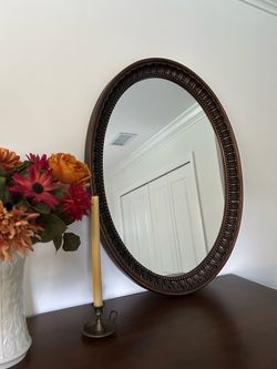 oval bronze wall mirror
