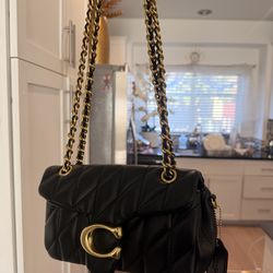 Coach black and gold taby bag